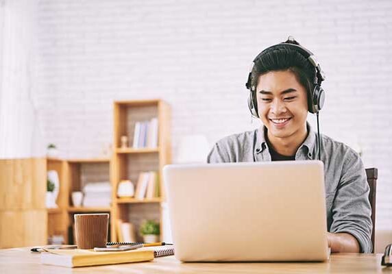 Student doing algebra homework on a laptop.