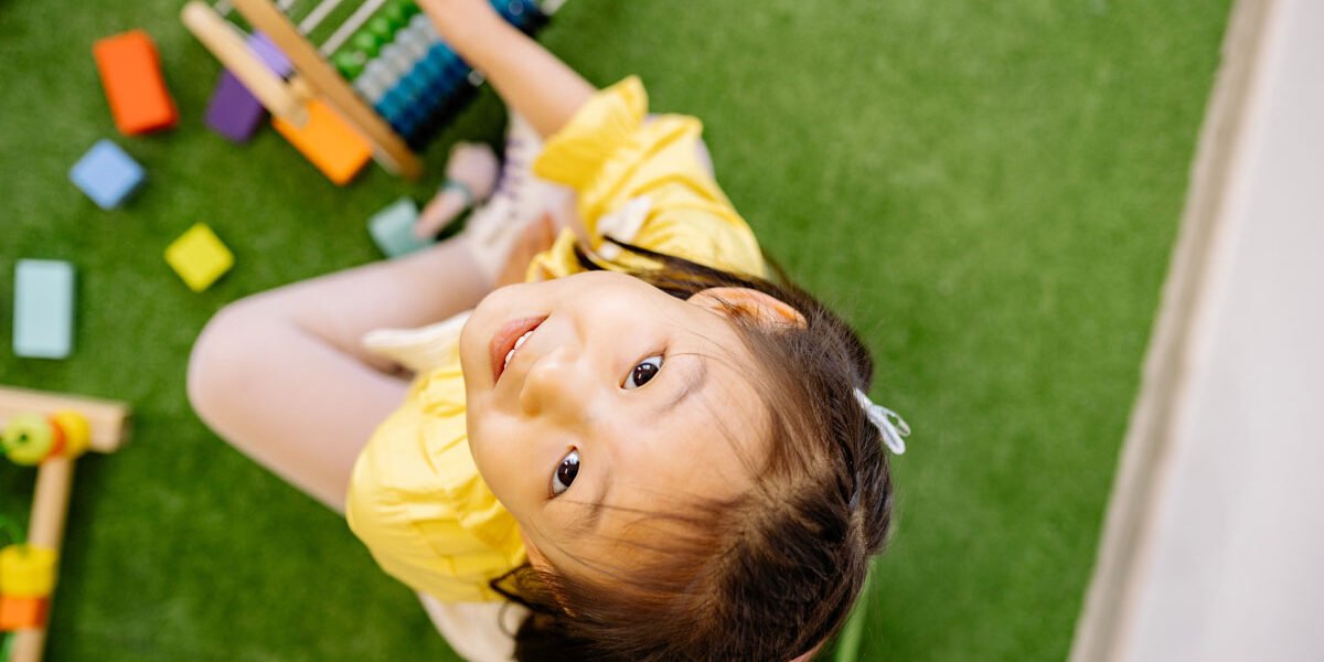 Girl with abacus on grass