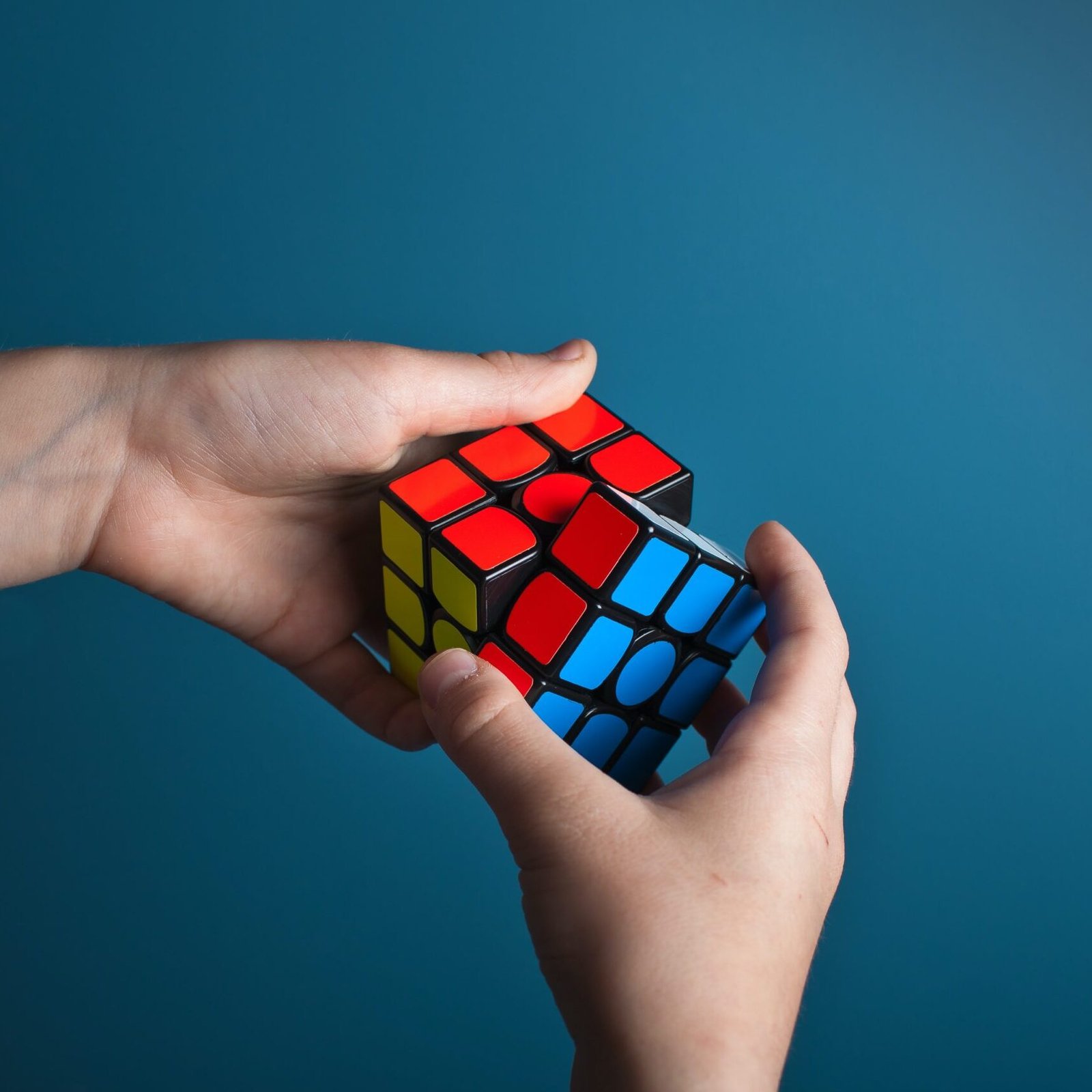 Person solving a rubik's cube