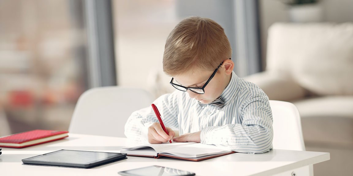 Boy sitting at desk studying
