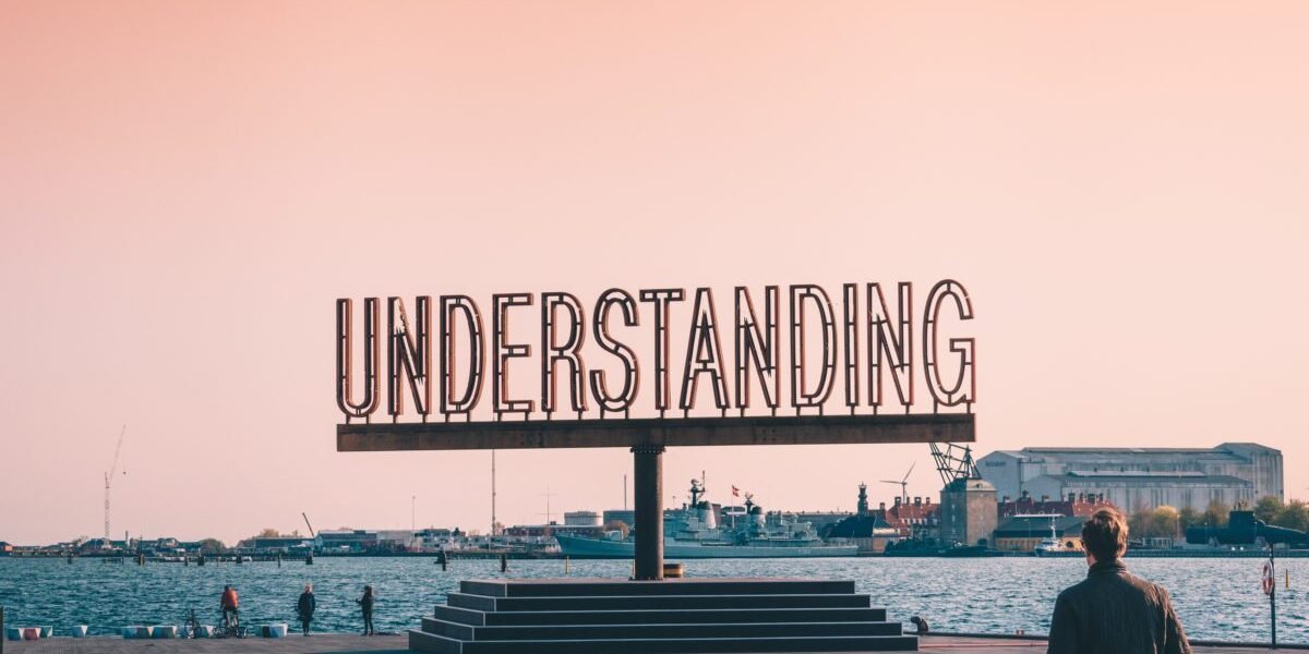 A sign with the words understanding